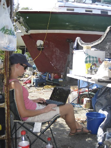 Jess doing university work on the laptop beside Teleport