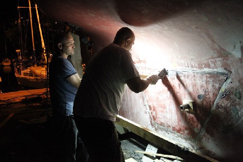 Bill and his mate Chris finishing up on the keel, putting old piece back on
