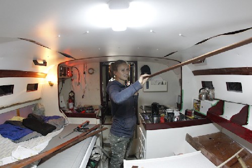 Putting capping strips of wood to cover the joins in the ceiling