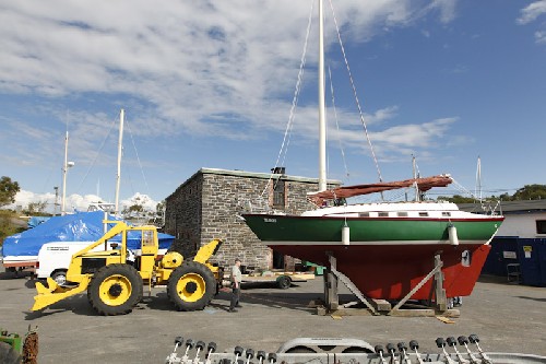 Teleport being towed past the old jailhouse