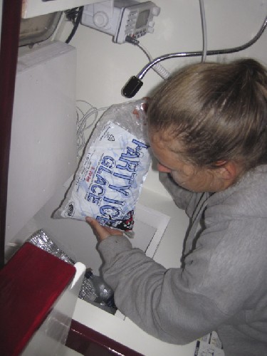 Putting ice in our amazing icebox