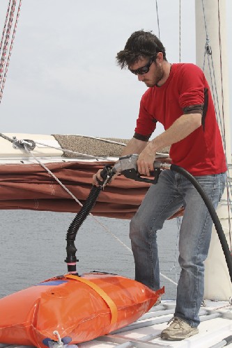 Filling up our 100L Turtle-Pac flexible tank on deck with diesel