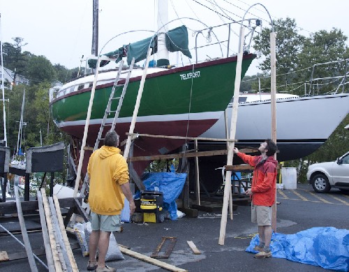 Chris and Terry setting up a frame for the tarp cover