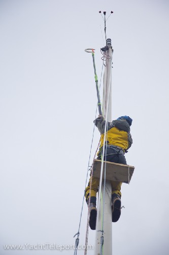 Using our Happy Captain pole to try and hook the halyard to pull back down