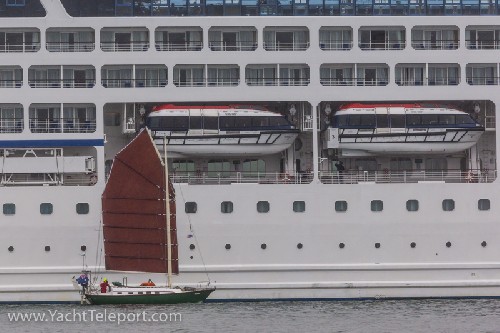Jess sailing Teleport beside cruise ship