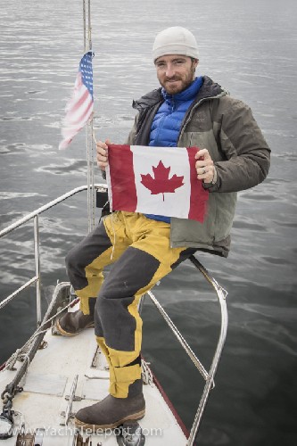 Putting up the Canadian and Q flag