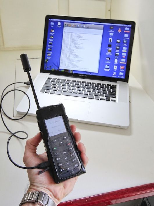 Using an Iridium satellite phone to connect our laptop to the Internet onboard Teleport.